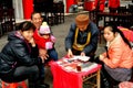 Pengzhou, China: Fortune Teller and Clients