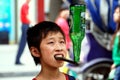 Pengzhou, China: Little Boy Balancing Bottle