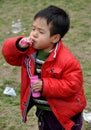 Pengzhou, China: Little Boy Blowing Bubbles