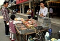 Pengzhou, China: Little Girl Buying Hot Dog
