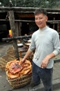Pengzhou, China: Man with Smoked Ducks