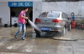 Pengzhou, China: Man Washing Car