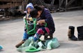 Pengzhou, China: Mother Repairing Chair