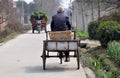 Pengzhou, China: Old Man with Bicycle Cart Royalty Free Stock Photo