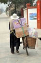 Pengzhou, China: Old Man Walking his Bicycle