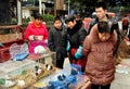 Pengzhou, China: People Looking at Caged Pets