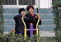 Pengzhou, China: People Using Exercise Machine