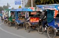 Pengzhou, China: Queue of Bicycle Taxis