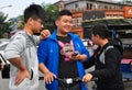 Pengzhou, China: Teens with Cellphone