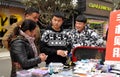 Pengzhou, China: Teens Selling Cellphone Covers