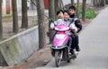 Pengzhou, China: Three Teens on Motorcycle