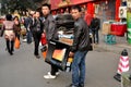 Pengzhou, China: Two Men Carrying Lenovo Computer