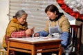 Pengzhou, China: Two Women Playing Cards