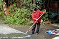 Pengzhou, China: Woman Raking Grains