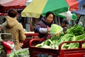 Pengzhou, China: Woman Selling Cabbages Royalty Free Stock Photo