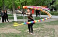 Pengzhou, China: Woman Spinning Top