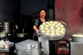 Pengzhou, China: Woman With Steamed Bao Zi Dumplings