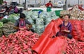 Pengzhou, China: Women Bagging Radishes Royalty Free Stock Photo