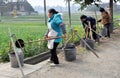 Pengzhou, China: Women Filling Water Buckets