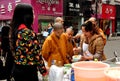 Pengzhou, China: Women Monks Buying Food