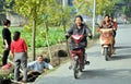 Pengzhou, China: Women on Mopeds Royalty Free Stock Photo