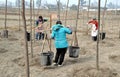 Pengzhou, China: Women Watering Trees