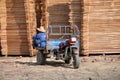 Pengzhou, China: Worker in Lumber Yard Royalty Free Stock Photo