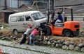 Pengzhou, China: Workers Righting A Van