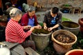 Pengzhou, China: Workers in Temple Courtyard Royalty Free Stock Photo