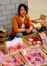 Pengzhou, China: Young Woman Selling Mooncakes