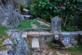 Old fountain from 1919 and a mossy stone with a writing, Penha Garcia, Portugal