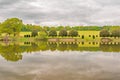 Penhurst Lake reflections on a cloudy day Royalty Free Stock Photo