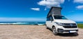 The new 2021 Volkswagen VW Transporter Camping Van T6.1 California Ocean in the coastal Nature Royalty Free Stock Photo