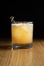 Penicillin - a whiskey-based alcoholic cocktail with lemon juice and honey-ginger syrup in a transparent glass