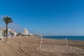 Peniscola beach with palm tree and volleyball net Costa del Azahar Spain