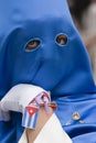 Penitent with caperuz blue of penetrating look and nice eyes during a procession of Holy Week