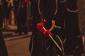 Penitent holding a lighted candle