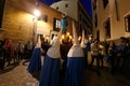 Penitents push the christ sculpture during an easter holy week procession in mallorca detail on hoods detail