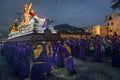 Penitents carrying a float with the image of Jesus Christ in an Easter procession at night during the Holy Week in Antigua, Guatem Royalty Free Stock Photo