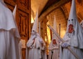 Penitents wait inside the church for the start of their Easter holy week in mallorca