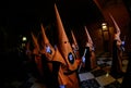 Penitents wait on queue before the start of an easter holy week procession in mallorca detail on hoods wide