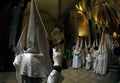 Penitents walk inside church before the start of an easter holy week procession in mallorca wide