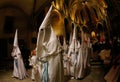 Penitents walk inside church before the start of an easter holy week procession in mallorca