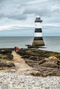 The Penmon point lighthouse is located close to Puffin Island on Anglesey, Wales - United Kingdom Royalty Free Stock Photo