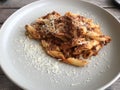 Penne Bolognese, pasta on grey plate