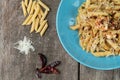 Penne with garlic and oil aglio e olio. Spicy pasta with prawns and cheese