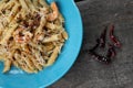 Penne with garlic and oil aglio e olio. Spicy pasta with prawns and cheese