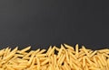 Penne pasta on black background Royalty Free Stock Photo