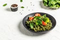 Penne pasta with broccoli, avocado sauce, spinach leaves and cherry tomatoes on liht background. Vegetarian healthy food. banner,