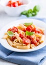 Penne pasta with cherry tomatoes and basil Royalty Free Stock Photo